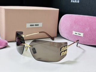 Gafas de sol Miu Miu Marrón y Dorado