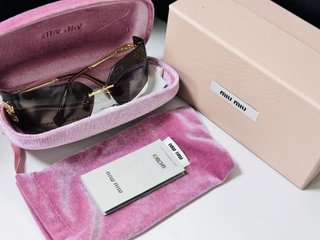 Gafas de sol Miu Miu Marrón y Dorado