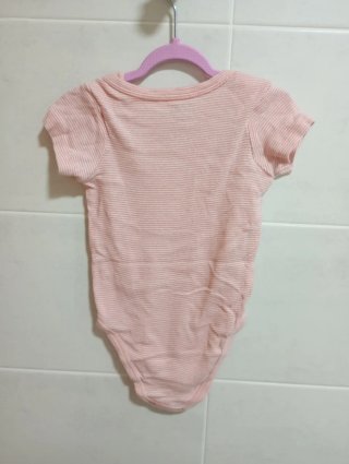 Body bebé rosa a rayas Kiabi
