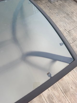 Tavolo da giardino in vetro e metallo