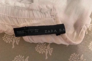Top smanicato bianco