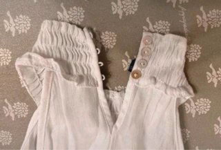 Top smanicato bianco