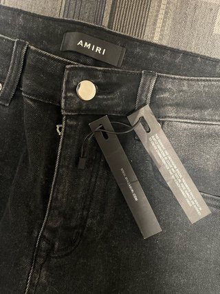 Pantalones Amiri Negros con Estampado Ángel