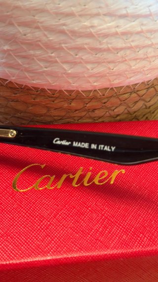 Gafas de sol Cartier negras y doradas