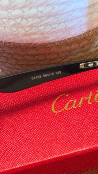 Gafas de sol Cartier negras y doradas