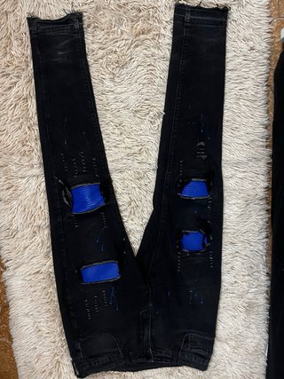 Jeans UOMK neri con strappi blu