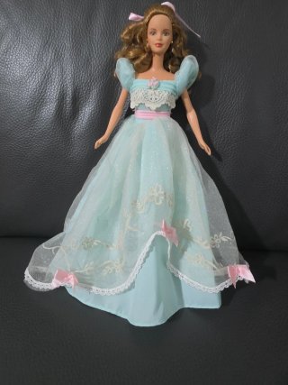 Vestito Barbie azzurro con fiocchi rosa