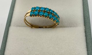 Anillo de oro 18 kt con turquesas