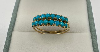 Anillo de oro 18 kt con turquesas