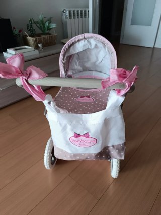 Carrito de bebé de juguete rosa