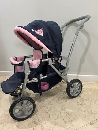 Carrito de muñecas rosa y azul