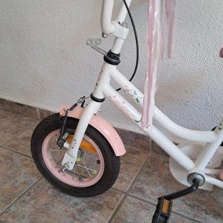 Bicicleta infantil rosa y blanca