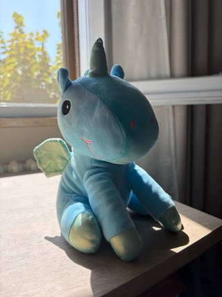 Peluche unicorno azzurro con ali