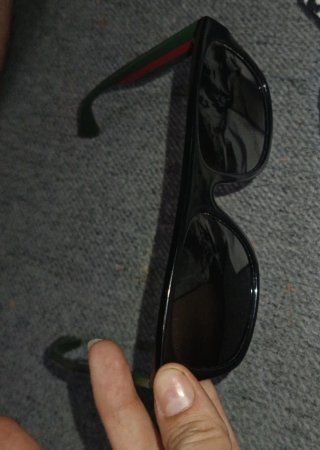 Gafas de sol Gucci negras y verdes