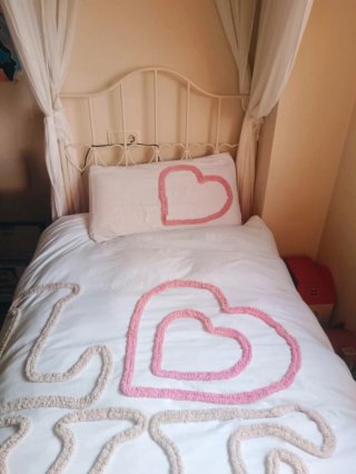 Cama de forja blanca con dosel