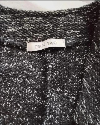 Chaqueta jaspeada negra y blanca