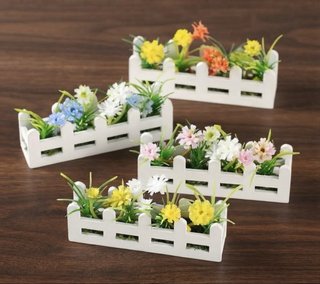 Imán decorativo, jardinera con flores.