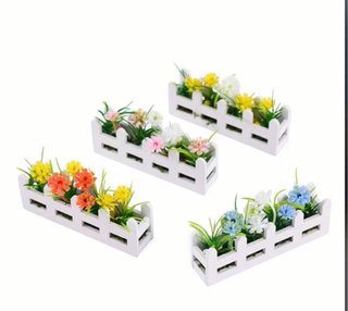 Imán decorativo, jardinera con flores.