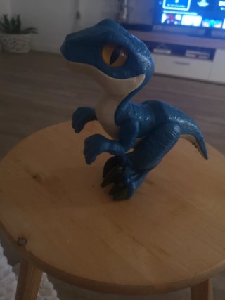 Dinosaurio de juguete azul