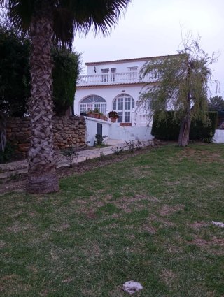 Terreno con casa