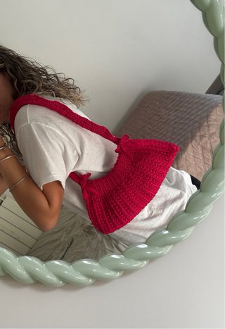 Borsa all'uncinetto rosa con fiocchetti