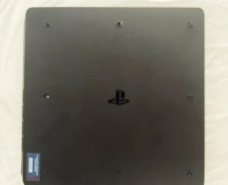 PS4 (PlayStation 4) Negra + 5 juegos de la FIFA