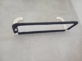 Barra protectora anti caídas para cama.