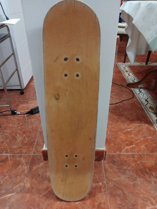 Monopatín Oxelo con diseño de lobo