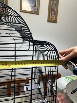 Jaula para pájaros negra y beige