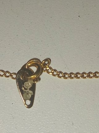 Colgante Tumi Perú artesanal y cadena dorada Avon