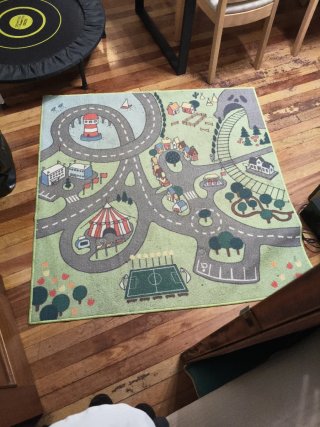 Alfombra infantil de tela con diseño de ciudad