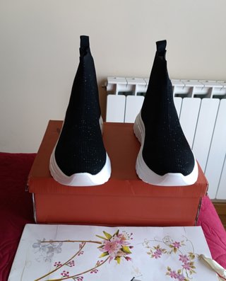 Botín gliter Exé plantilla piel de cuña de 105€