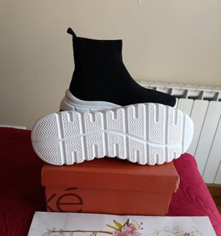 Botín gliter Exé plantilla piel de cuña de 105€