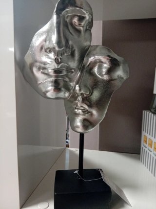 Scultura decorativa a due volti