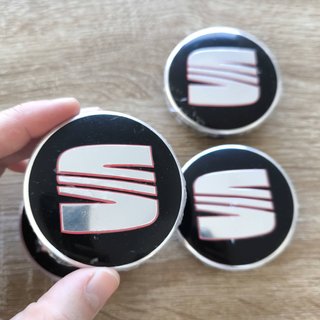 TAPABUJES SEAT 63mm NEGROS CON EMBLEMA PLATA ROJO