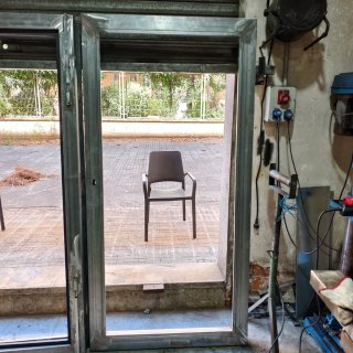 Puerta metálica doble para acristalar