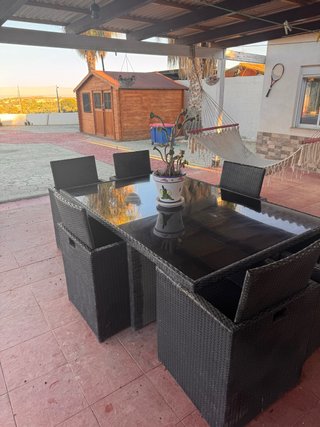 Mesa cristal negro y 6 sillas jardín