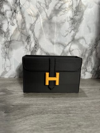 Organizador tocador Hermès negro y dorado