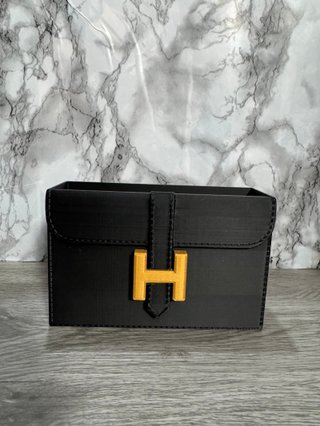 Organizador tocador Hermès negro y dorado