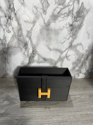 Organizador tocador Hermès negro y dorado
