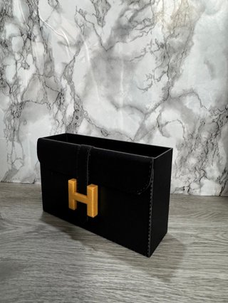 Organizador tocador Hermès negro y dorado