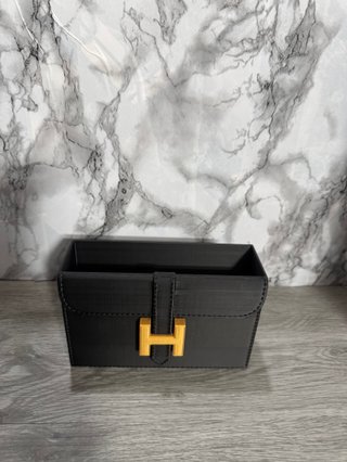 Organizador tocador Hermès negro y dorado