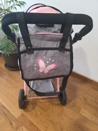 Carrito gemelar de muñecas con bolso.