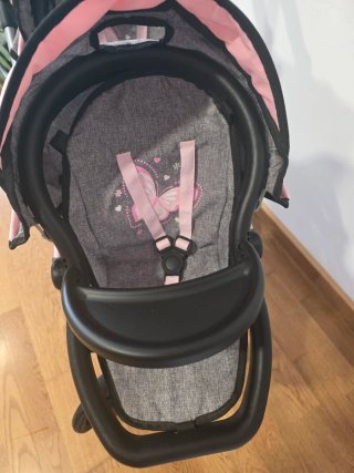 Carrito gemelar de muñecas con bolso.
