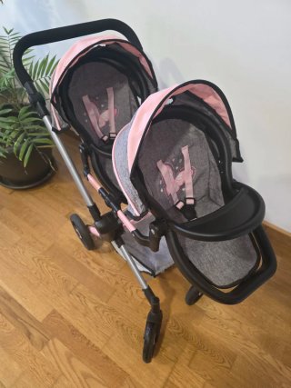 Carrito gemelar de muñecas con bolso.