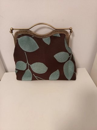 Bolso de mano con estampado de hojas