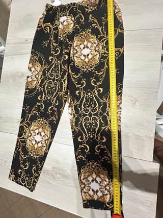 Pantaloni Akè neri con stampa oro