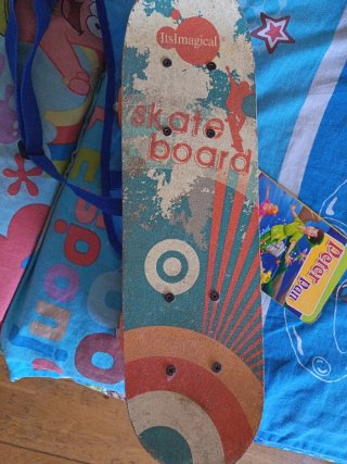Monopatín Imaginarium con mochila