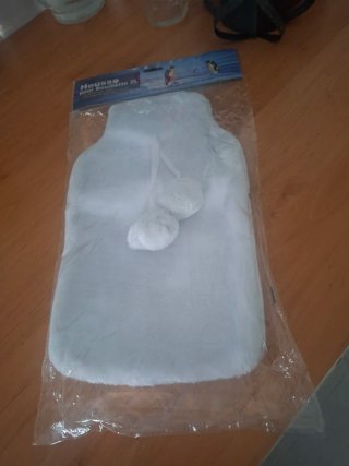 Bolsa de agua caliente con funda blanca