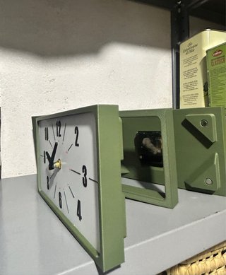 Orologio bifacciale da parete
